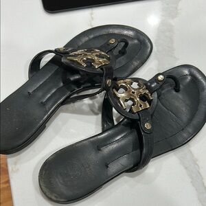 Tory Burch Black and Gold Sandals with Elegant Embellishments